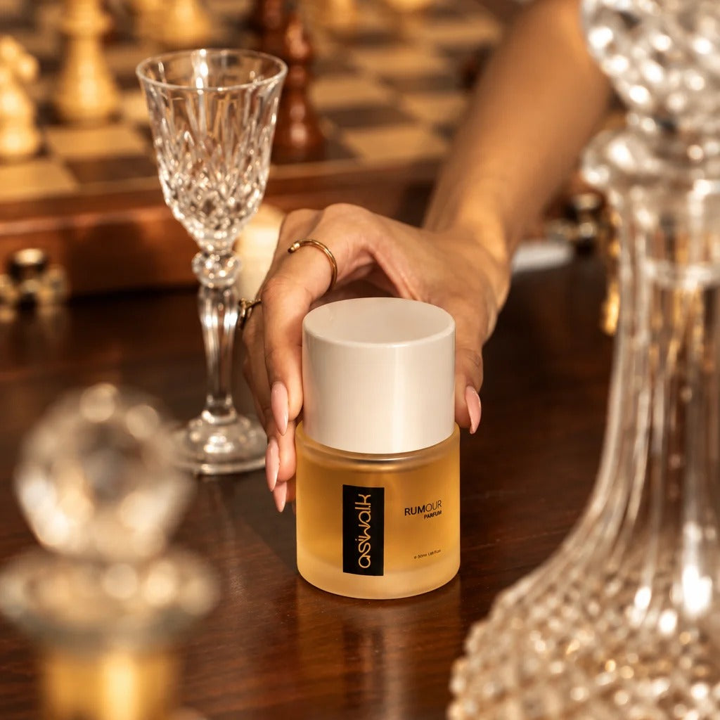 Rumour 50ml parfum bottle held in hand